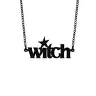 Matte black witch necklace shown hanging. 