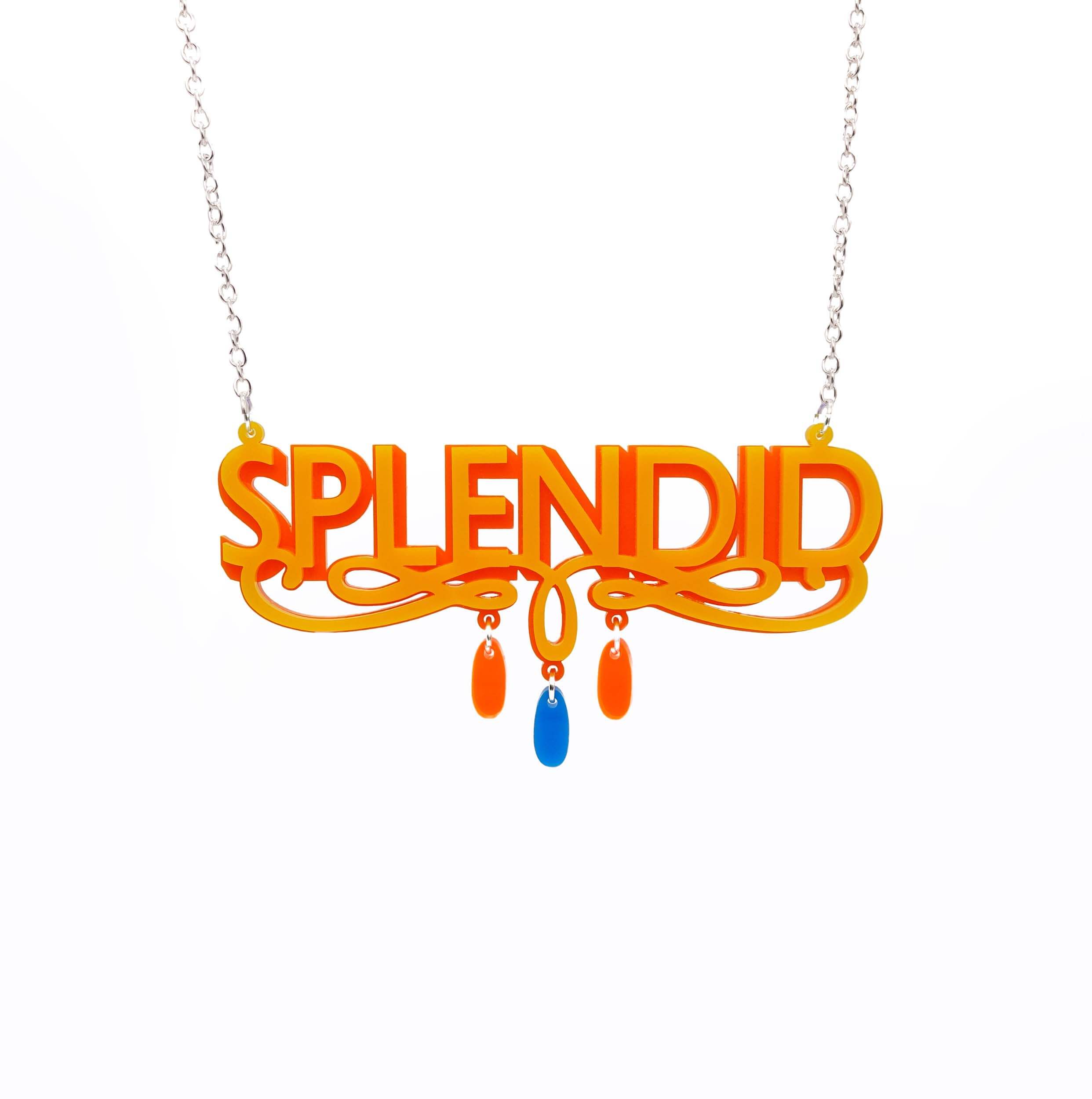 Sunflower yellow and orange Splendid necklace shown hanging against a white background. 